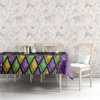 Purple glitter Mardi Gras tablecloth with diamond pattern and bead-necklace centerpiece design