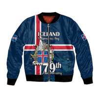 Blue unisex bomber jacket with zip front, ribbed cuffs, and Iceland flag graphic on front.