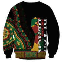 Black unisex sweatshirt with multicolor African pattern and vertical Juneteenth text on back