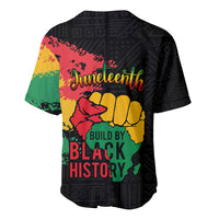Black V-neck baseball jersey back with Juneteenth logo, raised fist, and 'Build by Black History'.