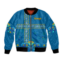 Blue bomber jacket with black ribbed trim, zip front, and 'Sverige' cross floral front panel