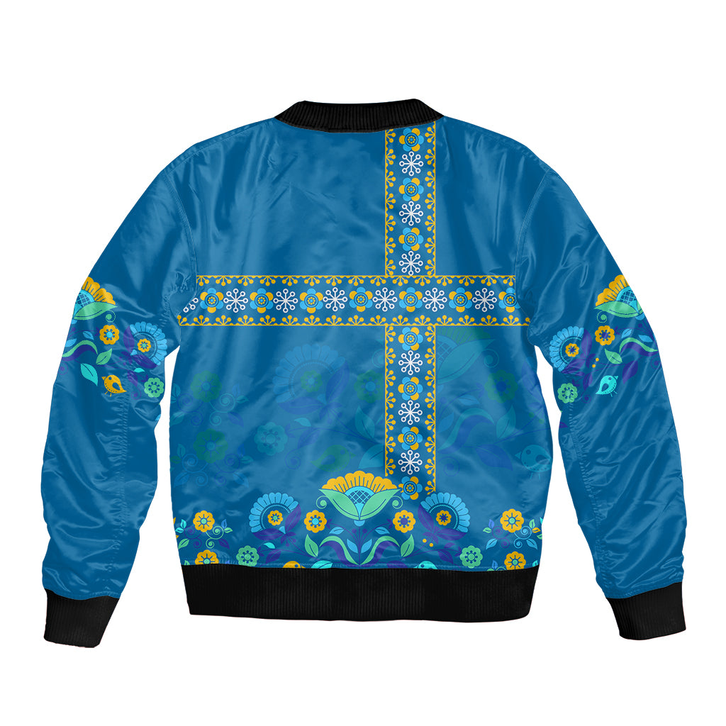 Blue bomber jacket with ribbed collar and hem, colorful cross floral pattern