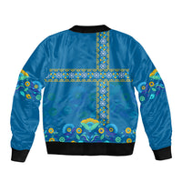 Blue bomber jacket with ribbed collar and hem, colorful cross floral pattern