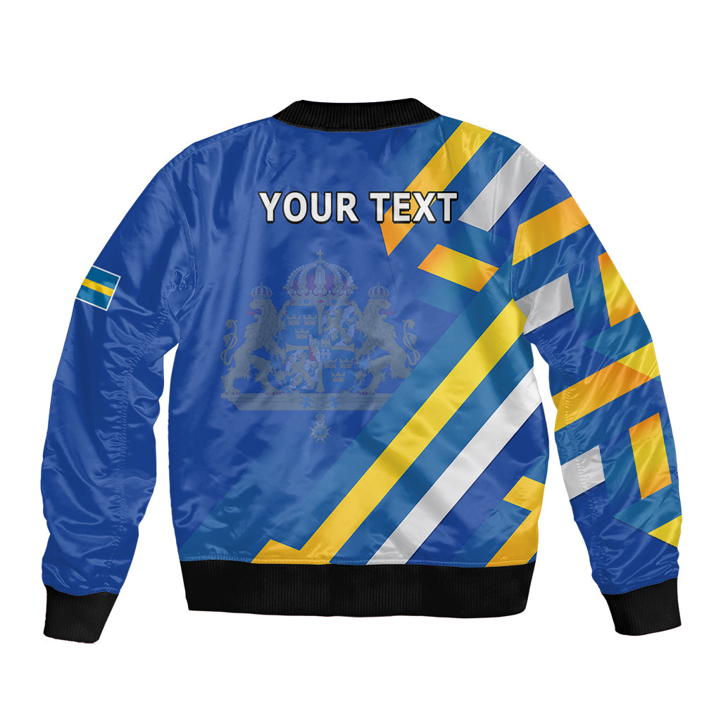 Blue bomber jacket back view with 'YOUR TEXT', Sweden flag diagonal stripes, ribbed hem.