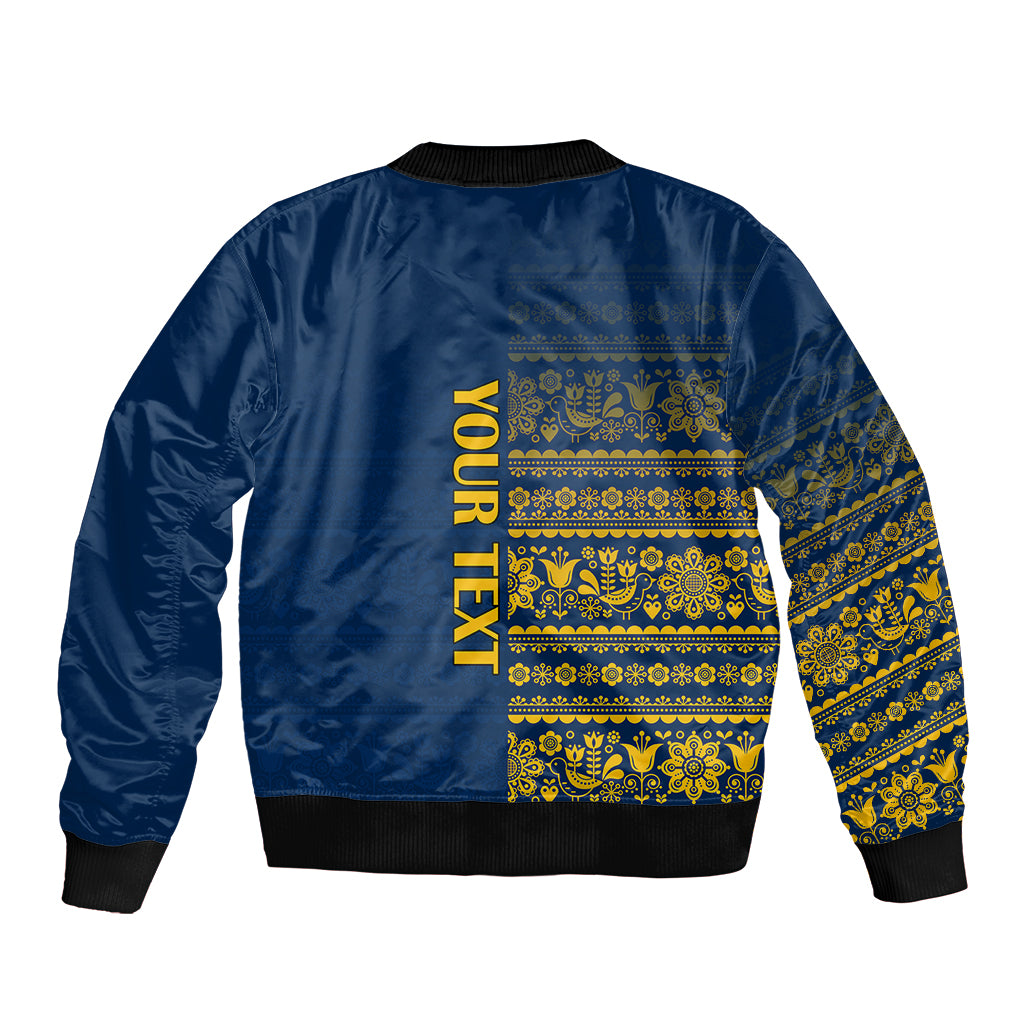 Blue bomber jacket back with gold Nordic bands and 'YOUR TEXT' print, ribbed hem
