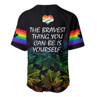 Black baseball jersey back with rainbow stripes, heart pride icon, 'BRAVEST...' text, and maple leaves.