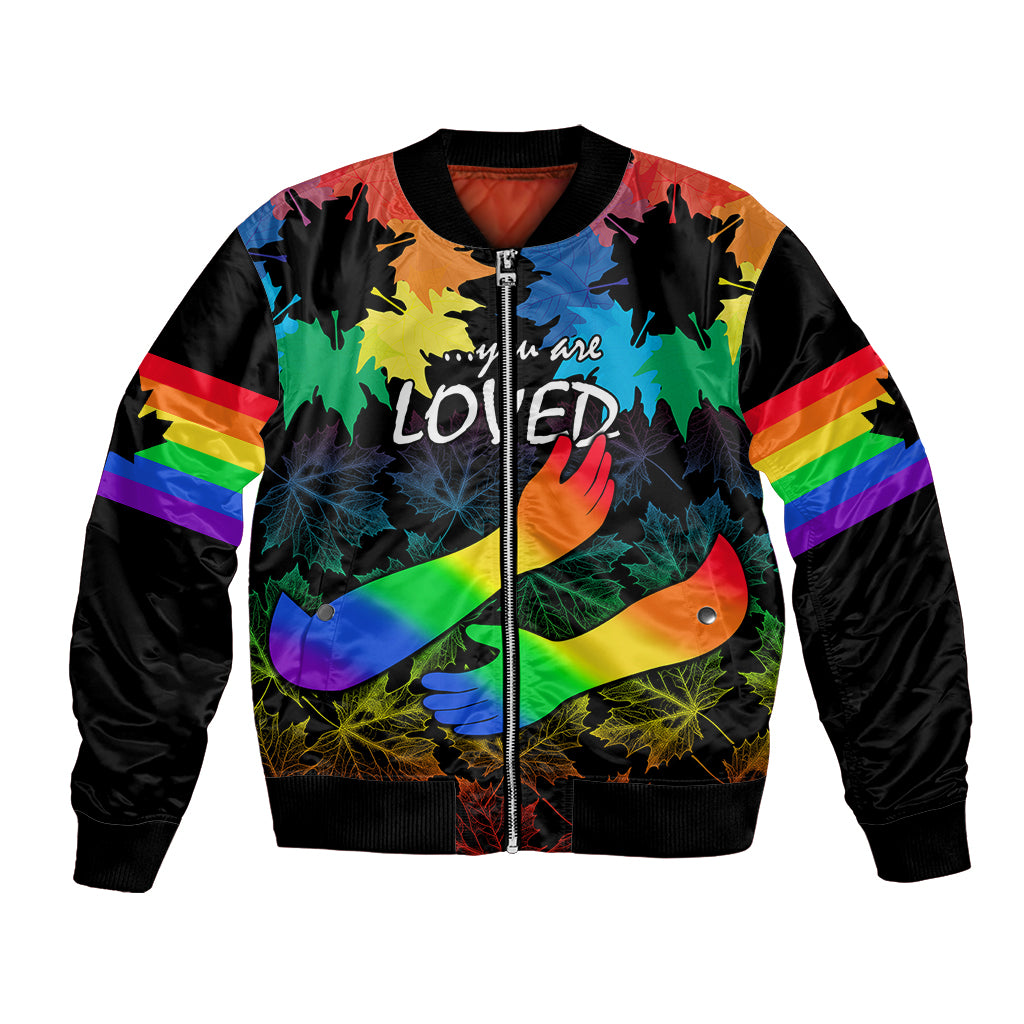 Black unisex bomber jacket with rainbow sleeve stripes and front maples graphic, zipped.