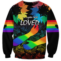 Unisex black sweatshirt with rainbow 'you are LOVED' graphic, maple leaves and hands