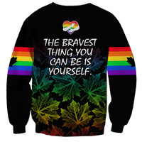 Unisex black sweatshirt with rainbow stripe sleeves and 'THE BRAVEST THING YOU CAN BE YOURSELF' text