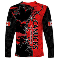 Back of red and black long sleeve soccer shirt with CANUCKS and maple leaf graphics