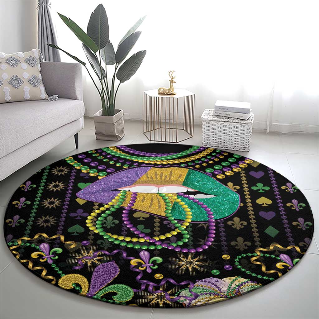 Round black Mardi Gras beads carpet with central lips queen motif in purple, green, and gold