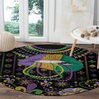 Round black Mardi Gras beads carpet with queen lips artwork, green purple accents, and sparkles