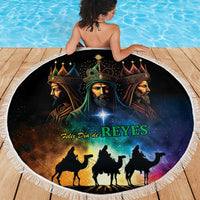 Black round beach blanket with fringe showing Three Kings silhouettes under starry glow and “REYES”