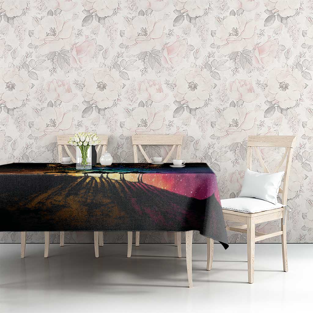 Black tablecloth with colorful starry landscape design on dining table