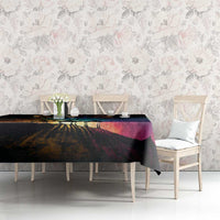 Black tablecloth with colorful starry landscape design on dining table