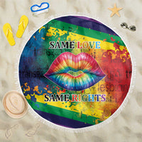 Round beach blanket with white fringe, rainbow lips graphic, 'Same Love' and 'Same Rights'.