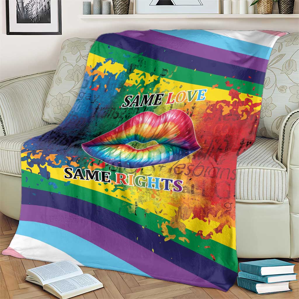 Rainbow lips kiss blanket on sofa, rainbow stripe design with lips graphic and “Same Love / Same Rights”.