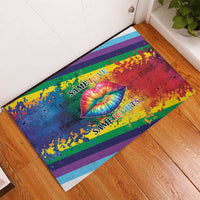 Rainbow lips rubber doormat on wood floor showing “Same Love” and “Same Rights”