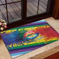 Rainbow striped rubber doormat with rainbow lips and “Same Love / Same Rights” on porch