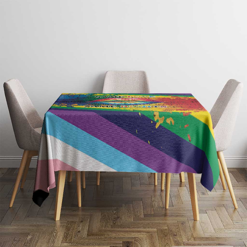 Rainbow pride tablecloth on dining table with multicolor stripe pattern and clean drape