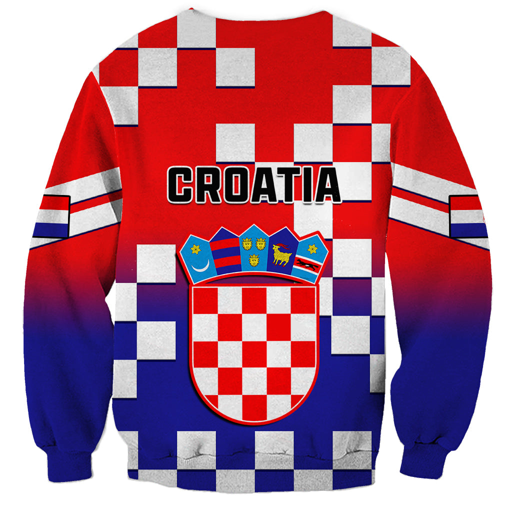Red crewneck sweatshirt with blue checkerboard pattern and Croatia crest graphic, CROATIA text