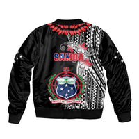 Black bomber jacket with ribbed cuffs and back Samoan crest graphic, red feather accents