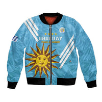 Light blue Uruguay football bomber jacket with full-zip front, black cuffs and sun crest