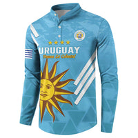 Light blue button-front football sweatshirt with sun and Uruguay crest graphic, front view