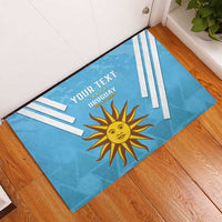 Custom Uruguay football rubber doormat in blue with sun emblem, stripes, and 'YOUR TEXT'.