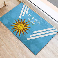 Blue Uruguay football rubber doormat with sun crest, bold stripe graphics, and 'YOUR TEXT'.