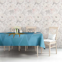Blue tablecloth with Uruguay sun emblem and diagonal stripe design on long dining table