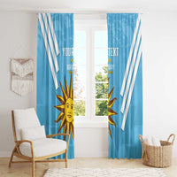 Blue window curtains with white stripes, sun Uruguay emblem, and custom text