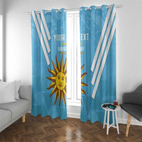 Blue window curtains with white diagonal stripes and Uruguay sun emblem, custom text