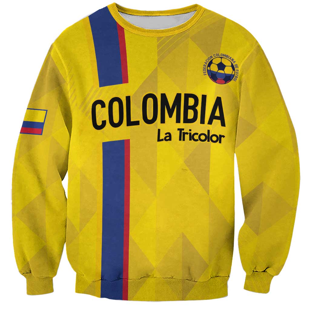 Yellow football sweatshirt with COLOMBIA graphic, La Tricolor text, crest on chest