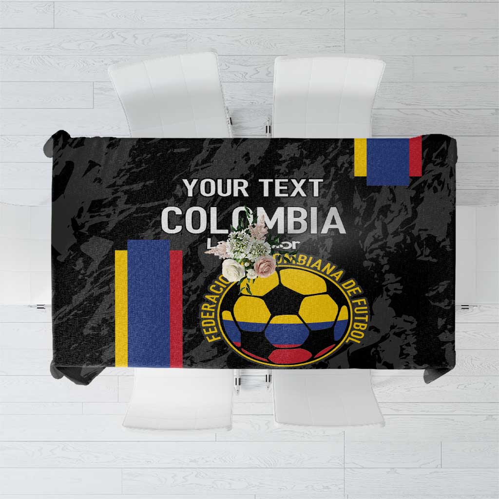 Black football tablecloth with Colombia crest and tricolor stripe accents, folded on table