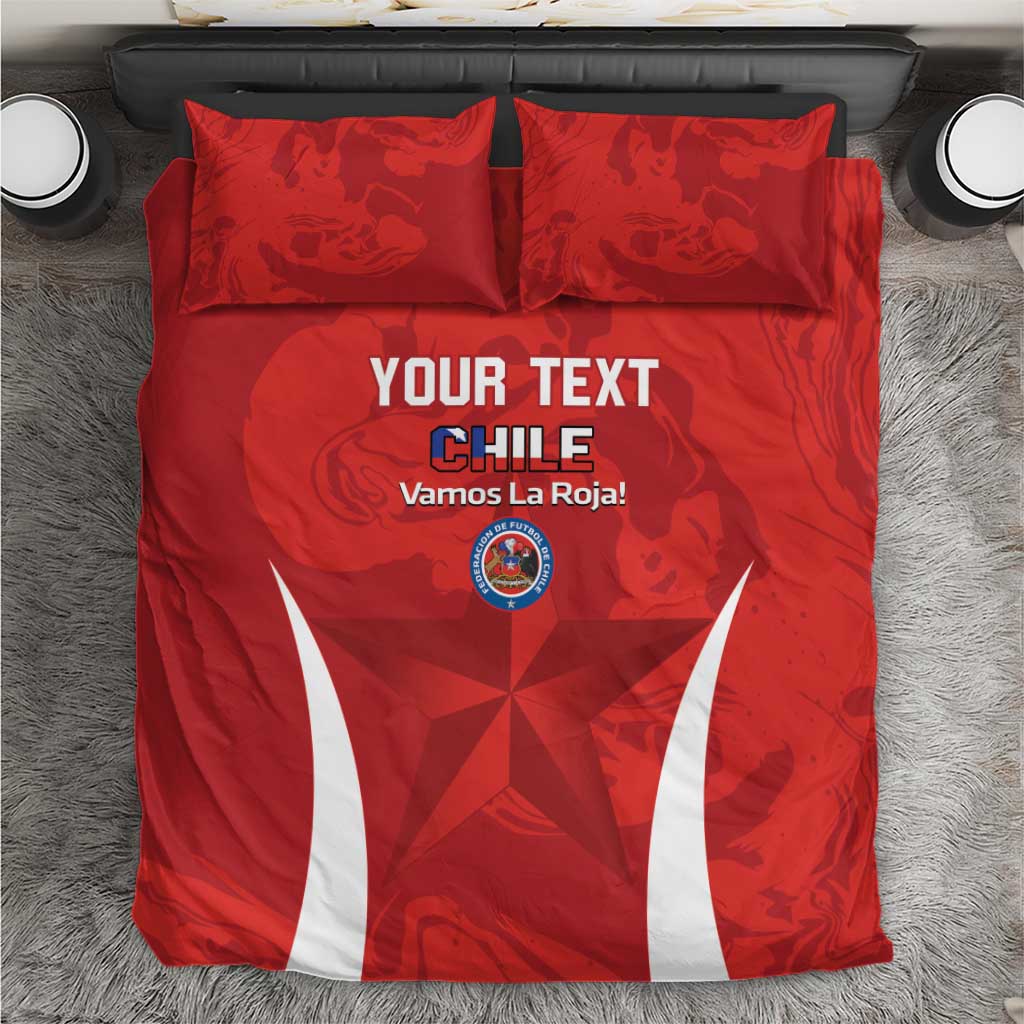 Top view of red Chile football bedding set with two pillows, crest logo, and white stripes