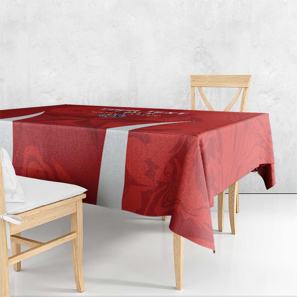 Red tablecloth with white side stripe and bold football-themed team graphics