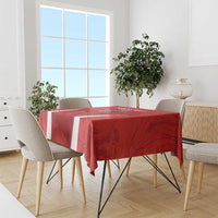 Red football-themed tablecloth with white stripes across the table edge