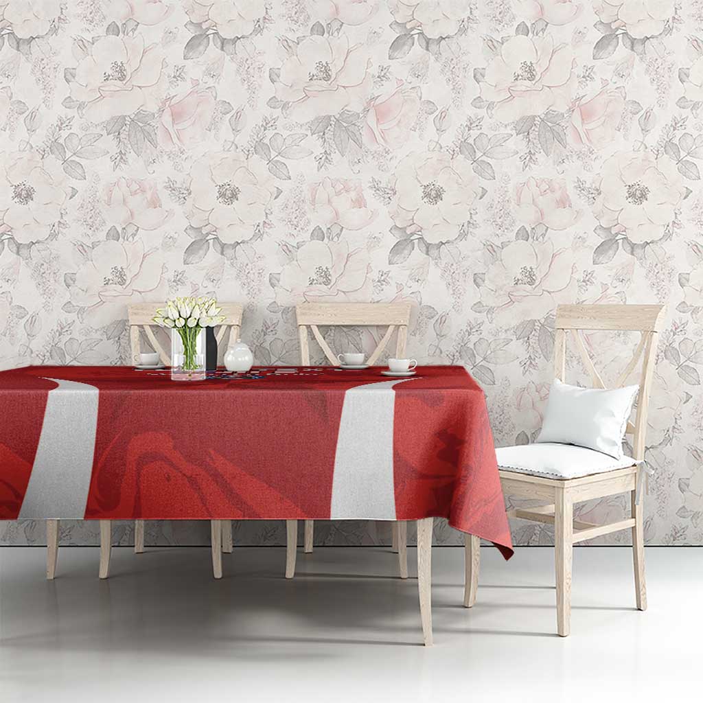 Red tablecloth with white stripe panel and football-themed printed artwork