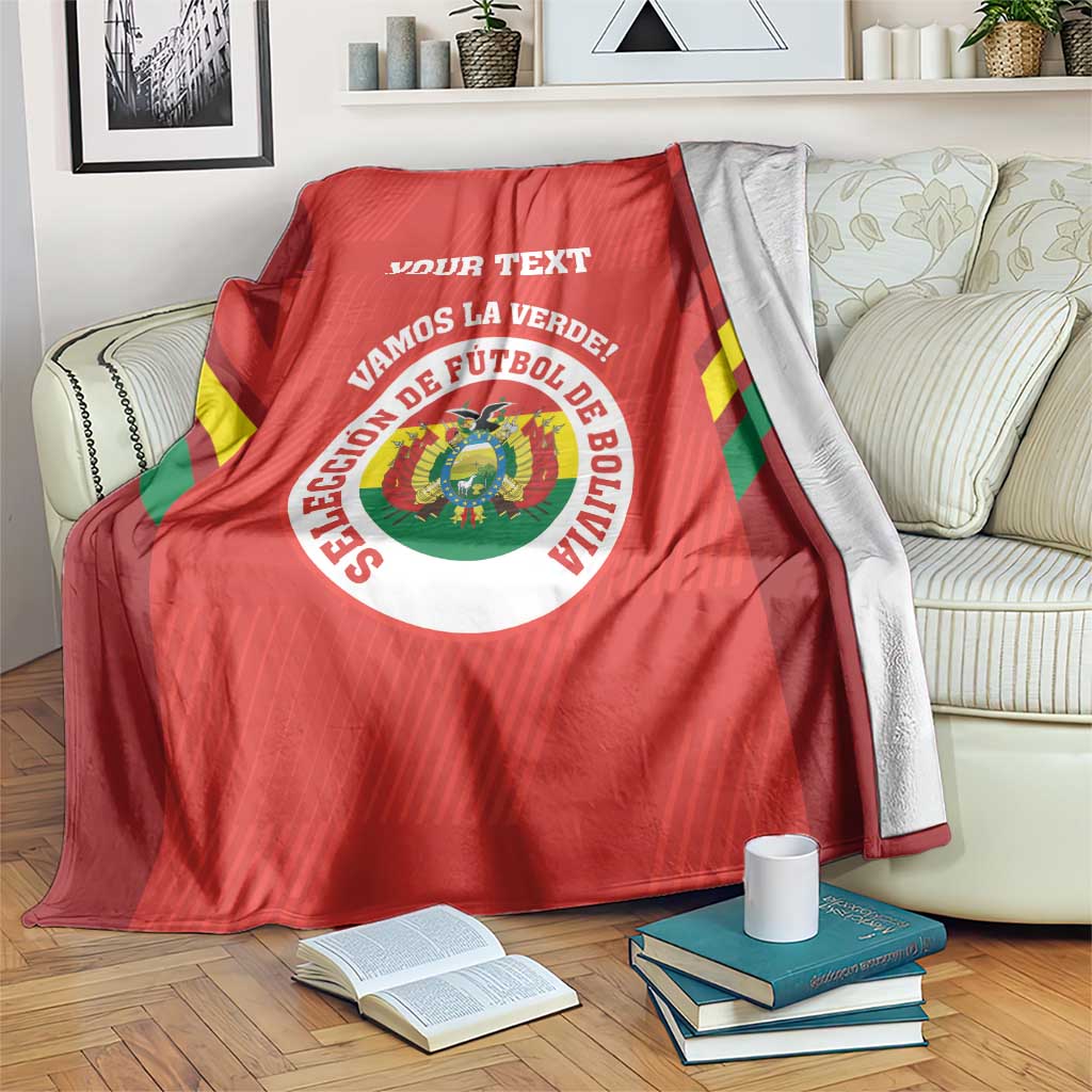 Red football blanket with Bolivian emblem, circular text, and “YOUR TEXT” in white