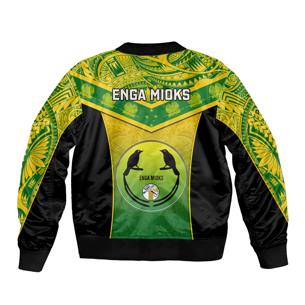 Unisex green and black bomber jacket with back graphic circle and 'ENGA MIOKS' lettering.