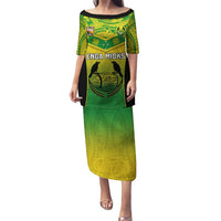 Green long dress with black jersey-style panel and yellow tribal pattern