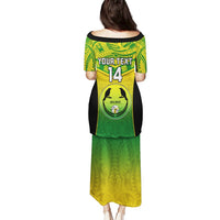 Back view green long dress with yellow tribal print and black graphic jersey panel