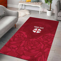 Red rectangular area rug with rose design and circular 'YOUR TEXT' patch