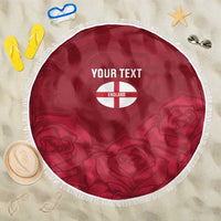 Red round beach blanket with white fringe, England crest and custom text at center