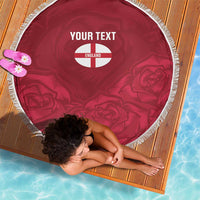 Red round beach blanket with white fringe, England crest and custom text at center
