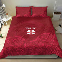 Red floral bedding set with England emblem and 'YOUR TEXT' on duvet and two pillows.