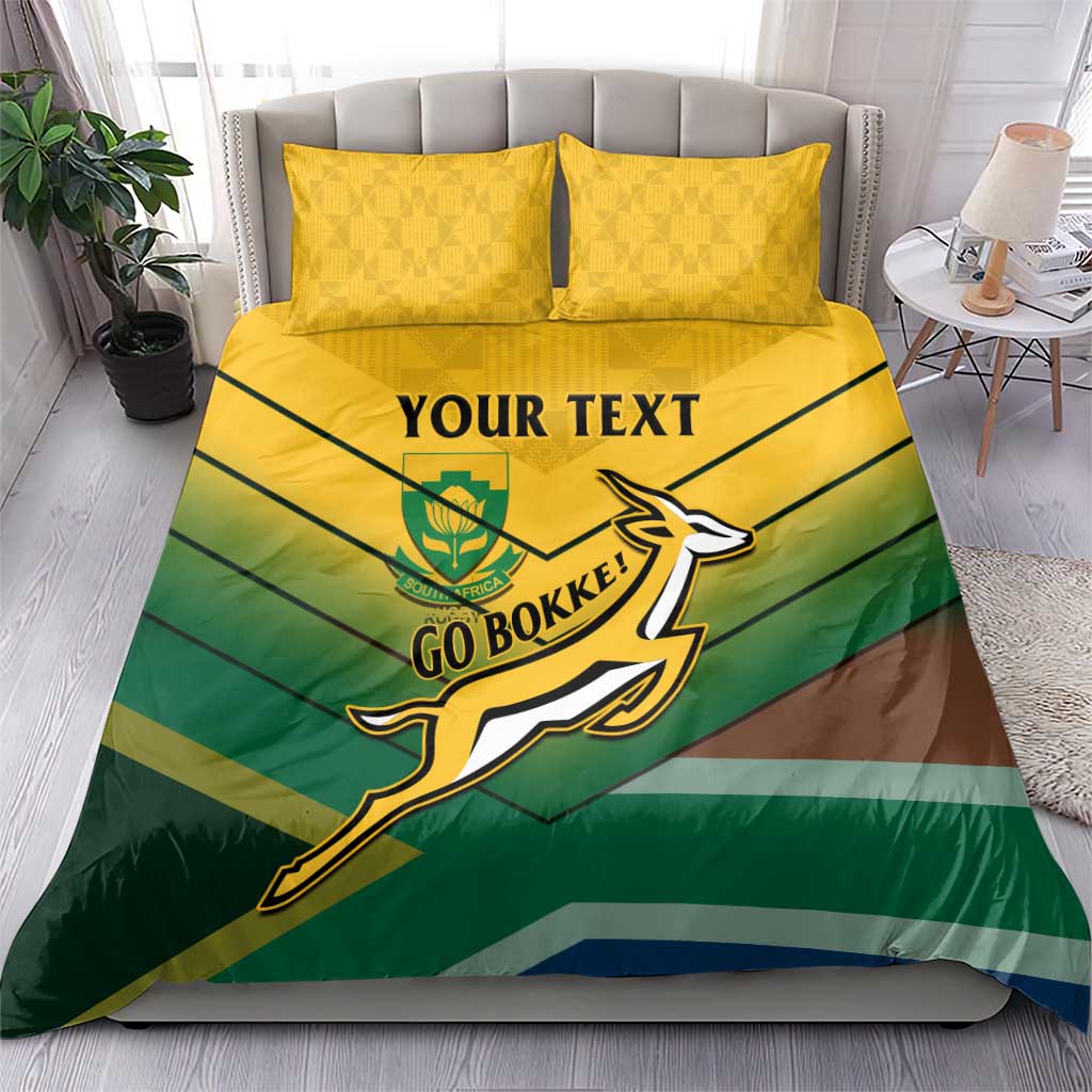 Green and yellow bedding set with “YOUR TEXT”, Go Bokke logo, and two yellow pillows