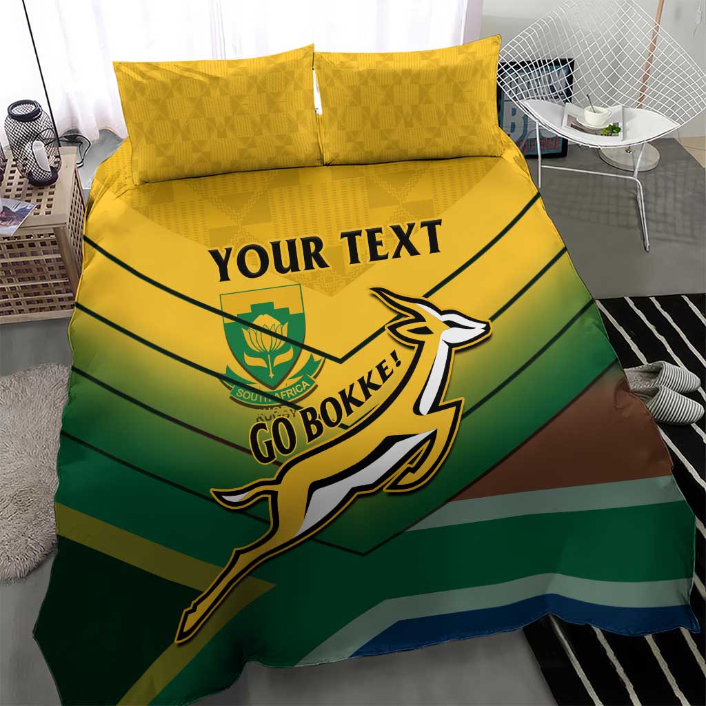 Green, yellow, and brown striped duvet cover with Go Bokke crest and two yellow pillowcases