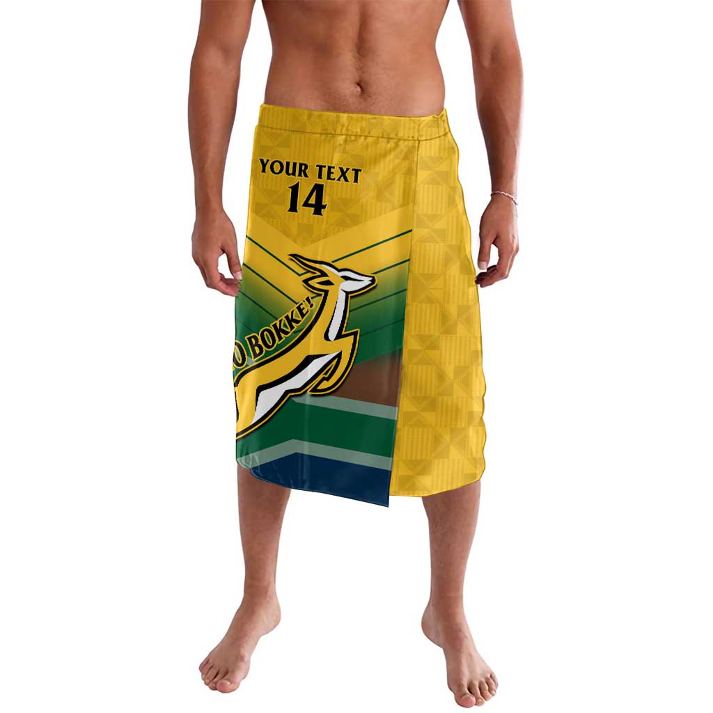 Yellow patterned lavalava wrap shorts with elastic waistband and team emblem